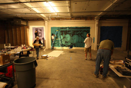 Projection paintings in progress with a crew of volunteers