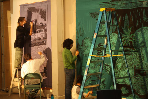 Projection paintings in progress with a crew of volunteers