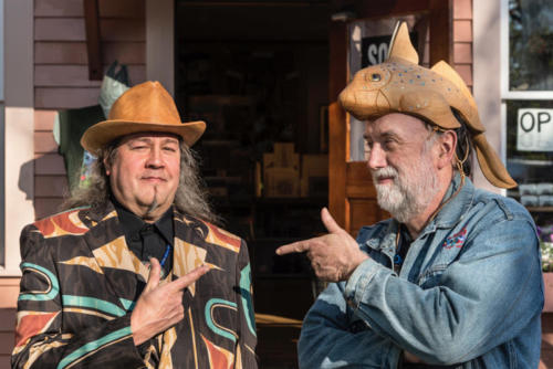 Tlingit artist Tommy Joseph, left, wears a suit he designed while Ray wears a ratfish helmet carved by Joseph.